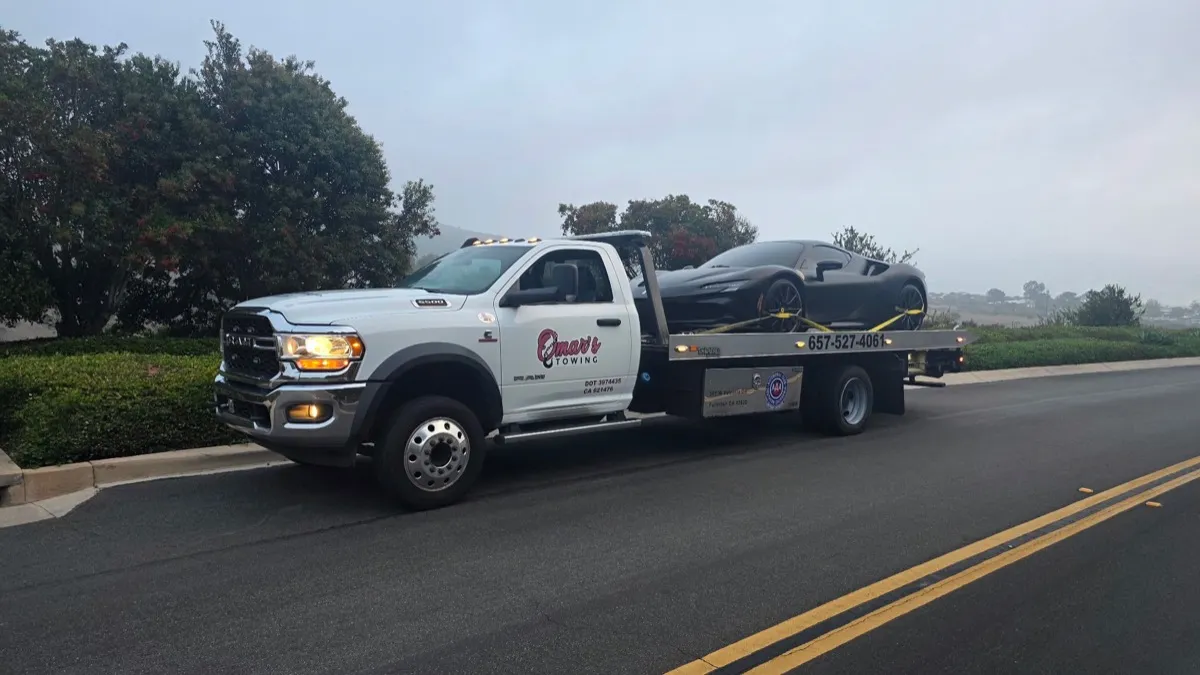 McLaren on flatbed tow truck